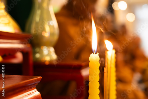 Yellow candles are lit in religious ceremonies