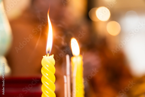 Yellow candles are lit in religious ceremonies