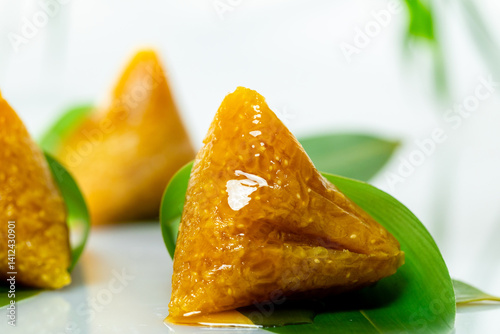 lye rice dumplings, honey, syrup, sweet, cantonese style, rice dumplings, glutinous rice, snack, dessert, cuisine, cuisine, close-up, three, leaves, golden, glossy, traditional, chinese, asian, orient