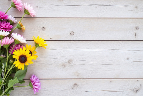bunch of flowers sitting on top of a wooden table