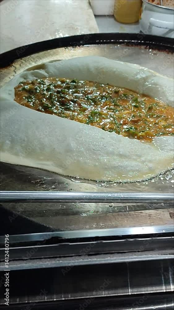 The process of cooking murtabak, Indonesian street food