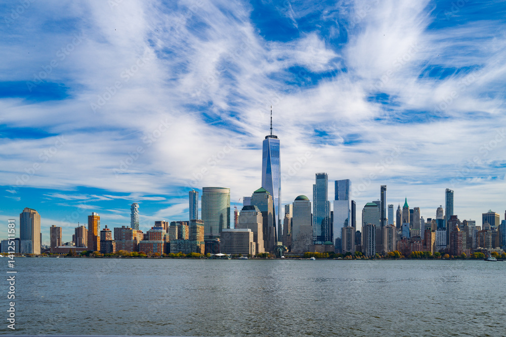 Fototapeta premium New York City Skyline with dramatic sky. American Urban Skyscrapers USA near dramatic clouds. New York City skyline, cityscape of Manhattan in USA. Panoramic view on Manhattan of NYC.