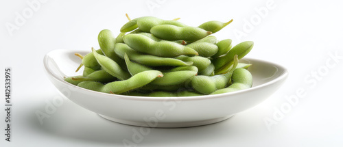 Obraz na płótnie Fresh edamame in white bowl, vibrant green and healthy, perfect for snacking or adding to dishes. Enjoy nutritious benefits w salonie