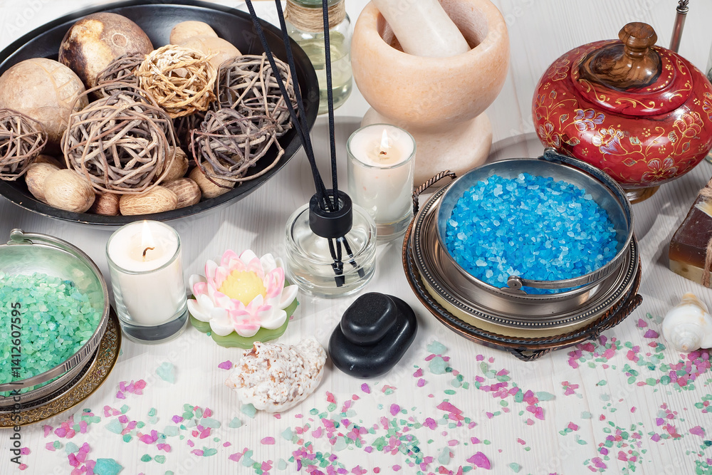 Spa treatment with candles and towel on wooden table, closeup
