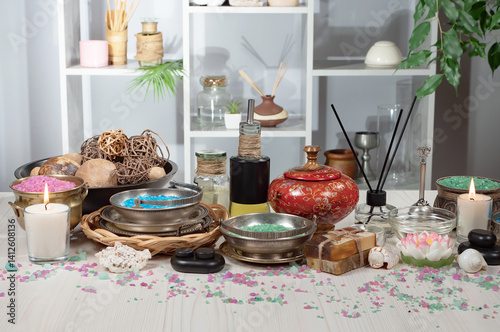 Spa massage items are arranged in a composition on the table.