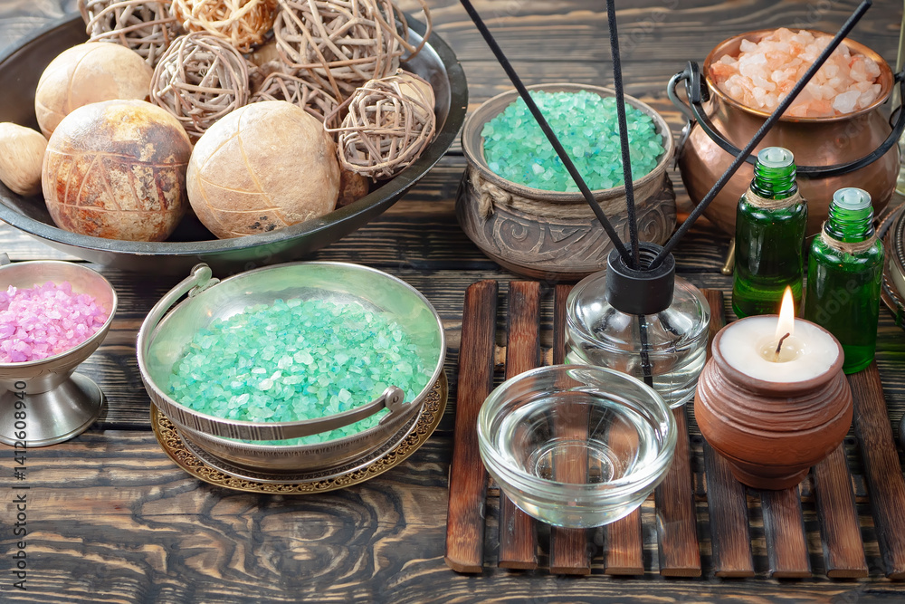 Spa treatment with candles and towel on wooden table, closeup