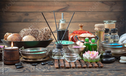 Spa massage items are arranged in a composition on the table.