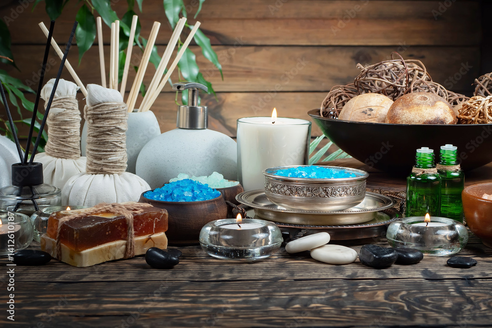 Spa treatment with candles and towel on wooden table, closeup