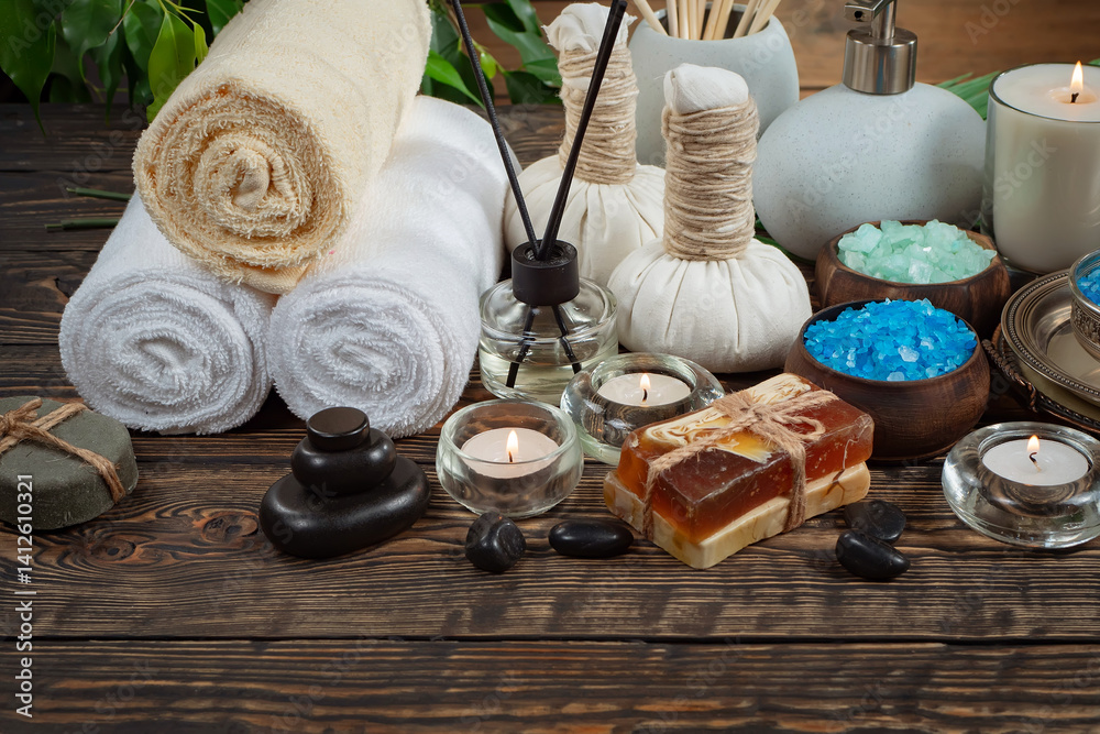 Spa massage items are arranged in a composition on the table.