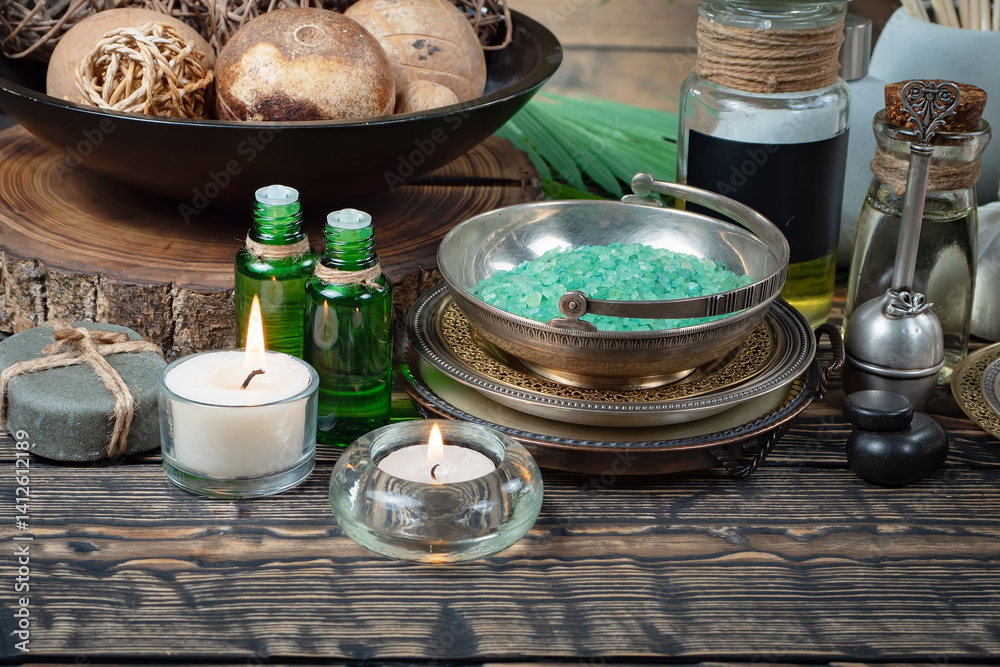 Spa treatment with candles and towel on wooden table, closeup