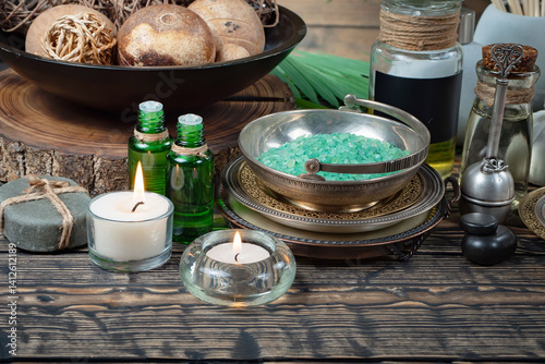 Obraz na płótnie Spa treatment with candles and towel on wooden table, closeup w salonie