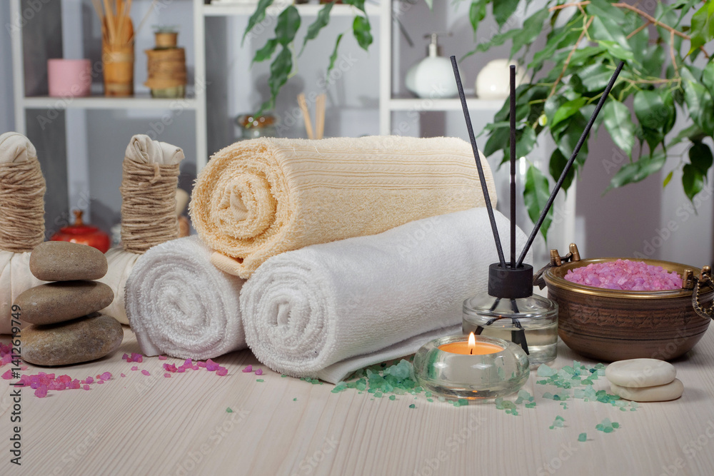 Spa massage items are arranged in a composition on the table.