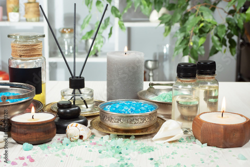 Spa massage items are arranged in a composition on the table.