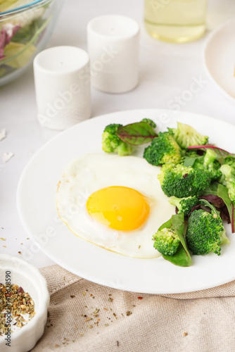 Plate with tasty fried egg,...