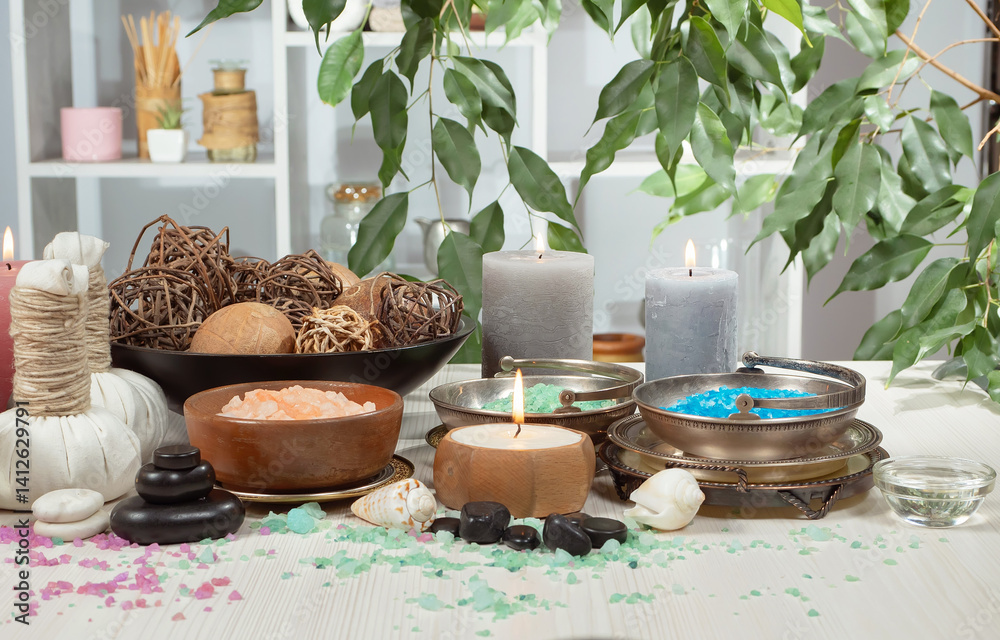 Spa treatment with candles and towel on wooden table, closeup