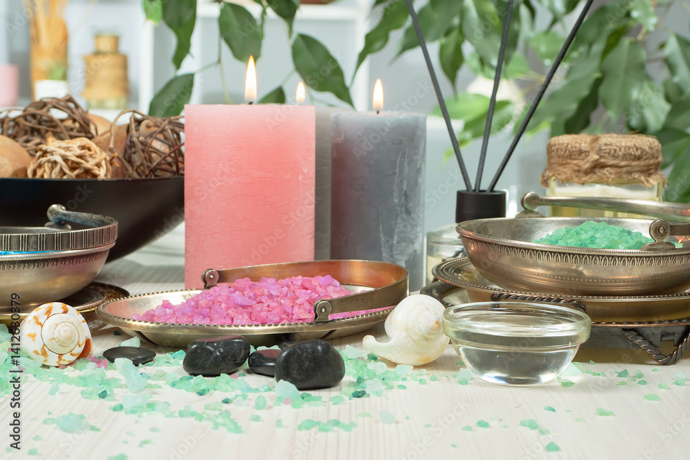 Spa treatment with candles and towel on wooden table, closeup