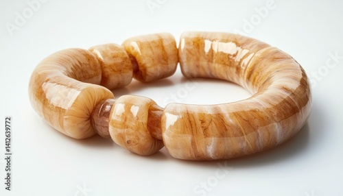 Delicious Ring of Sausage: A Mouthwatering Appetizer on a Clean White Surface