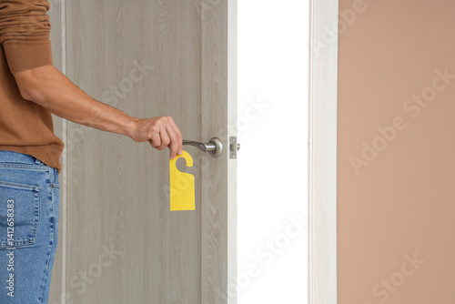 Male guest with door hanger...