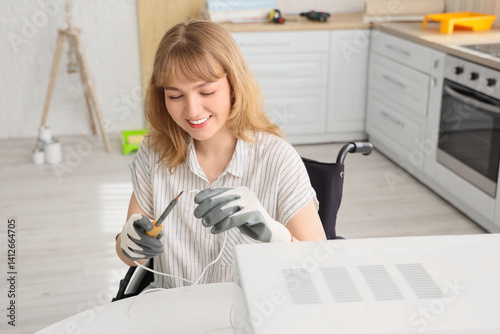Young woman in wheelchair r...