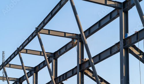 Obraz na plátně Welding process with bright sparks on a steel structure