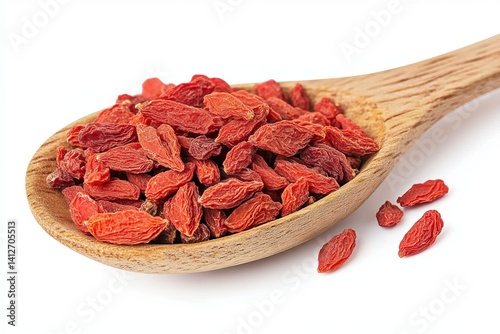 Suppose of dried goji berries on a wooden spoon, isolated over a white background, close-up view, side angle view. 