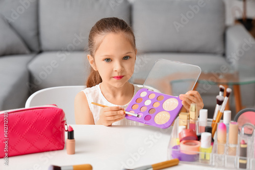 Cute little girl with cosme...