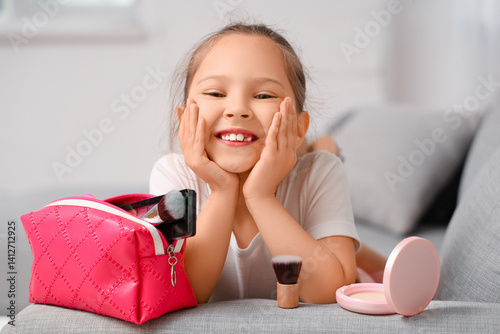 Cute little girl with cosme...