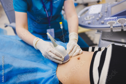 Shot of a pregnant woman during an ultrasound scan in a fertility clinic. Examination healthcare pregnancy gynecology people professionalism trust