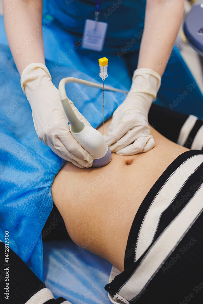Woman lying near doctor during pregnancy ultrasound. Checking pregnant woman during pregnancy disturbance