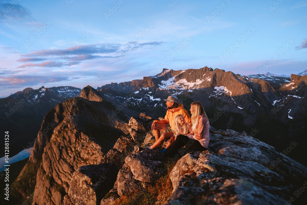 Fototapeta premium Family mother, father and child climbing mountains together in Norway summer vacations, adventurous people relaxing on summit outdoor hiking trip healthy lifestyle parents with kid enjoying landscape