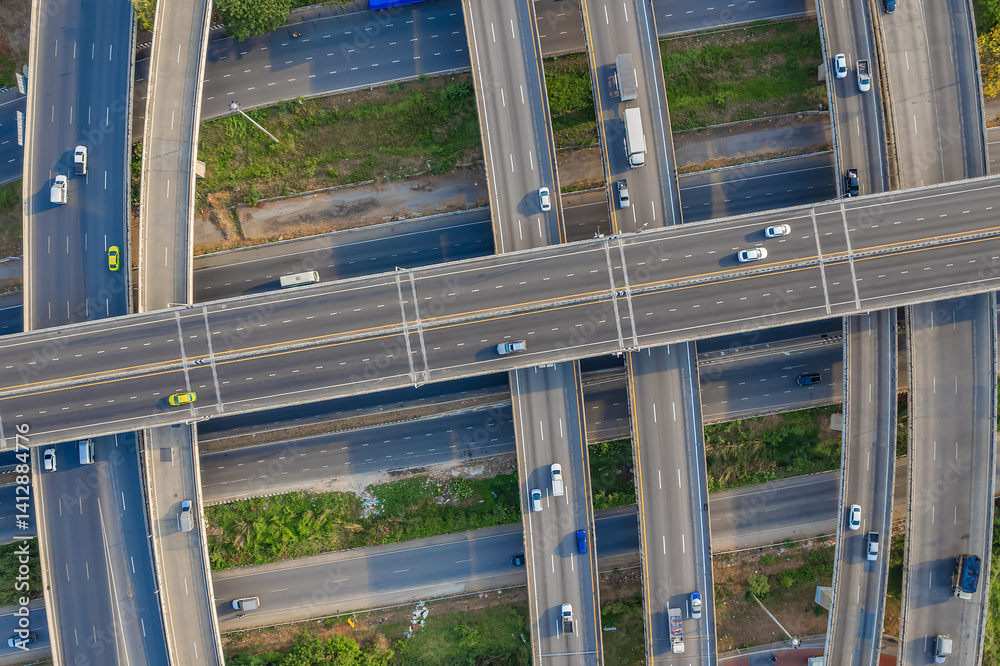 Aerial view of Expressway transport traffic road with vehicle movement in morning, Logistic concept. Aerial view of Expressway transport traffic road with vehicle movement in morning, Logistic concept.