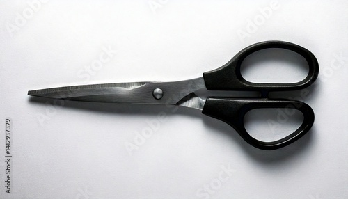 Top view of black scissors isolated on a white background. Clean and professional studio shot, ideal for office or school-themed projects.