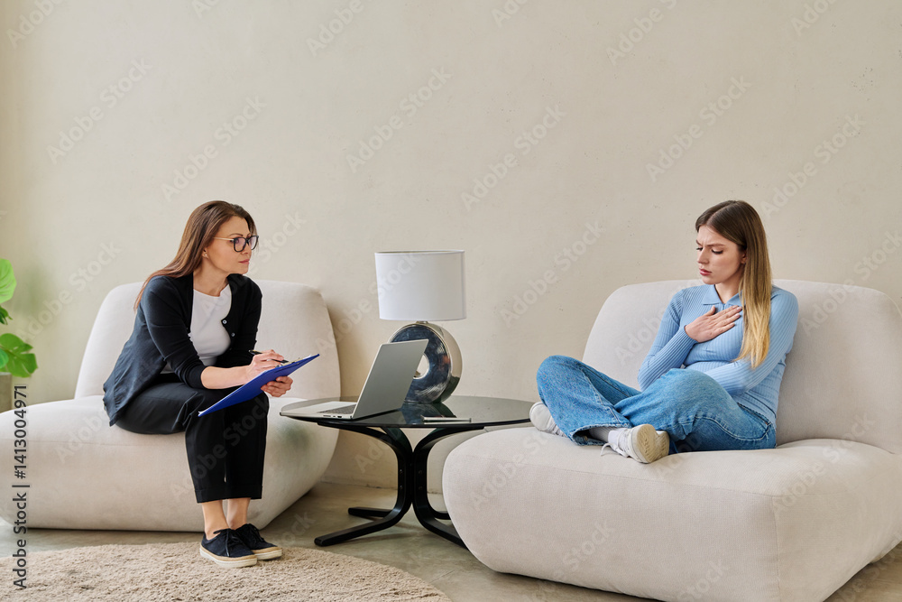 Young woman in mental therapy talking with professional psychologist, psychotherapist