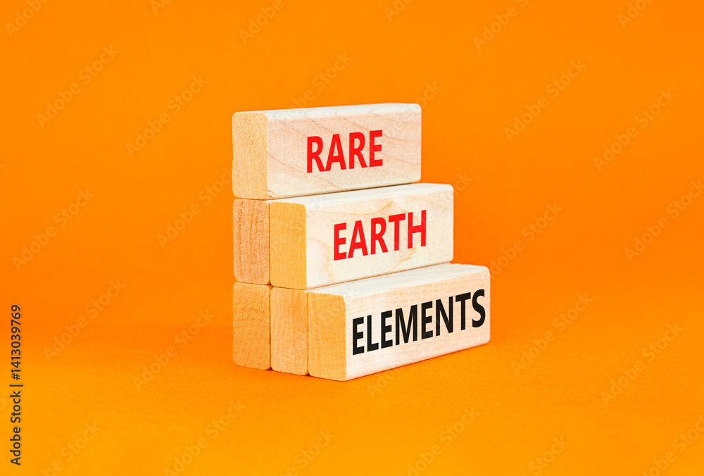 Naklejka premium Rare earth elements symbol. Concept words Rare earth elements on beautiful wooden block. Beautiful orange table orange background. Business and rare earth elements concept. Copy space.