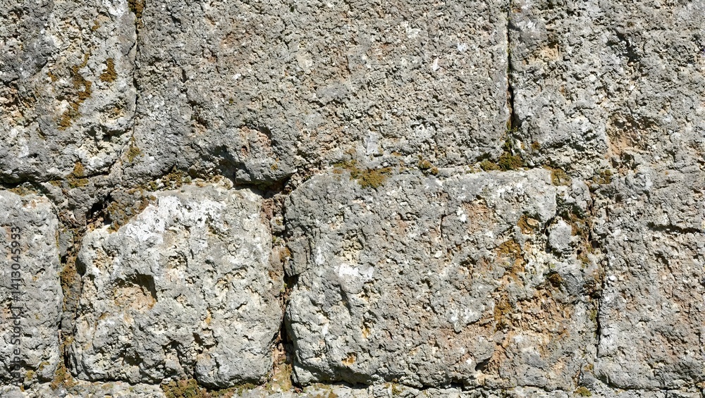 Obraz premium Detailed close up of weathered stone with moss capturing the essence of ancient history and resilience