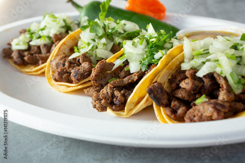A closeup view of some carne asada tacos.