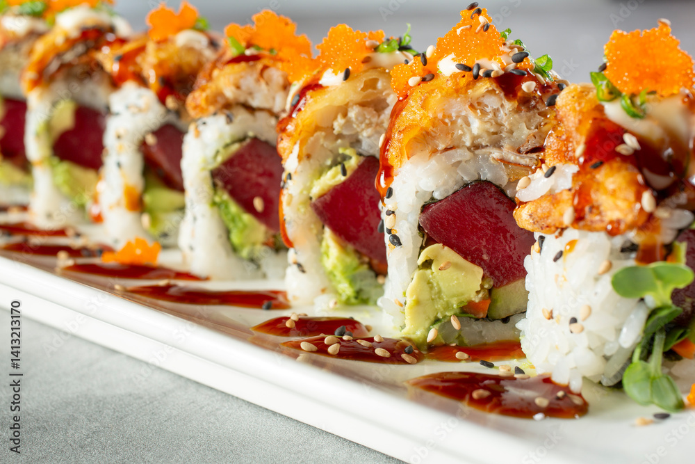 A view of a tuna avocado roll. A view of a tuna avocado roll.