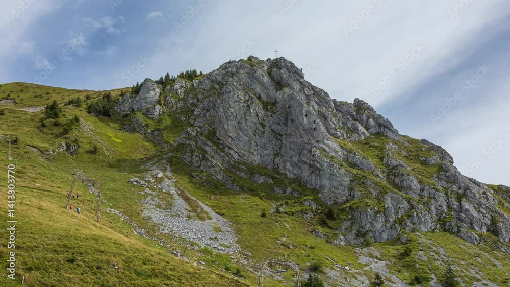 Time lapse, people climbing a mountain peak with a rope. Rock climbers. Brunnistoeckli, Zittergrat, Engelberg-Titlis, canton of Obwalden in Switzerland. Time lapse, people climbing a mountain peak with a rope. Rock climbers. Brunnistoeckli, Zittergrat, Engelberg-Titlis, canton of Obwalden in Switzerland.
