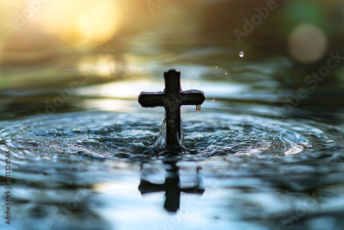 Dark Cross in Water with Ripples and Water Drops at Sunset