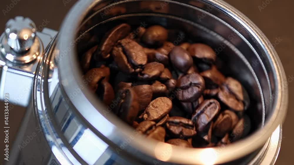 Roasted coffee beans in grinder Rich brown color texture visible Conveys freshness aroma Concept of coffee preparation brewing gourmet culture