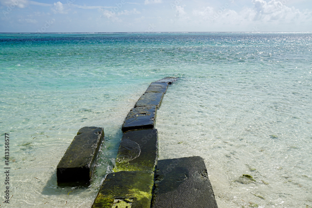 Jetty at Sunny tropical beach paradise on the Maledives