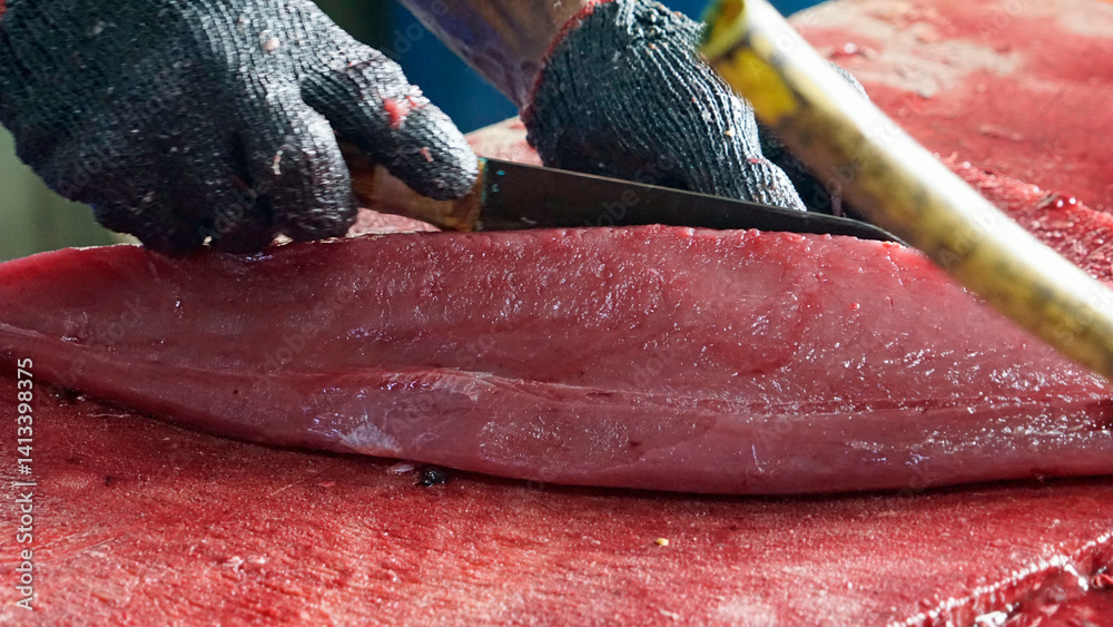 preparing fresh tuna steak at the fish market