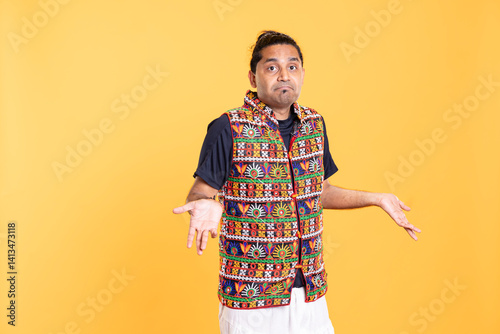 Portrait of unsure man shrugging shoulders, feeling stumped, puzzled about answer. Skeptical person doing questioning hand gesturing, showing lack of knowledge, isolated over studio backdrop