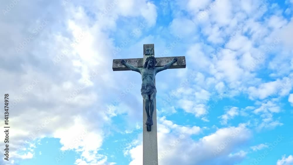 Stone statue representing Jesus Christ crucifixion, 4K clouds time lapse Stone statue representing Jesus Christ crucifixion, 4K clouds time lapse