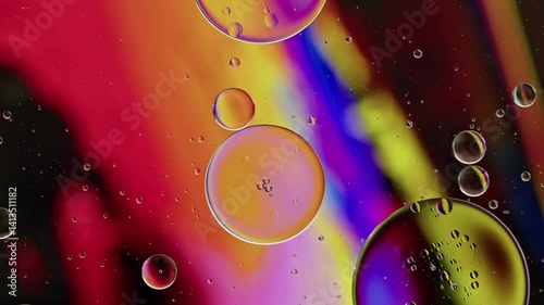Colorful Oil Bubbles Moving on a Water Surface