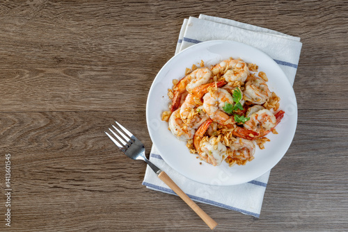 Fried shrimp with garlic and pepper on white plate - seafood style