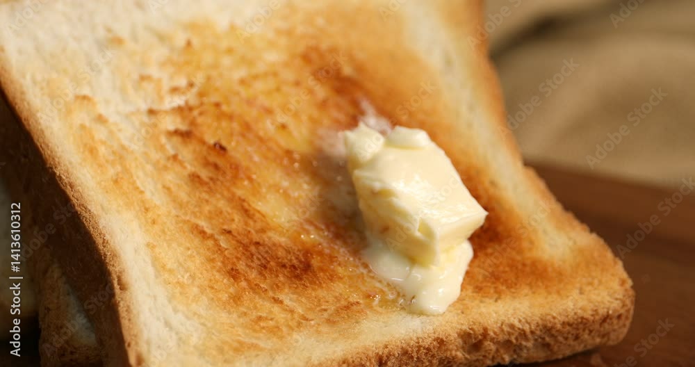 Butter melting on tasty crispy toast, closeup