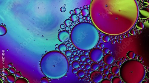 Colorful Oil Bubbles Moving on a Water Surface