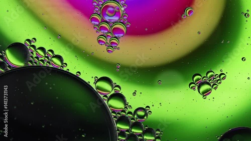 Colorful Oil Bubbles Moving on a Water Surface