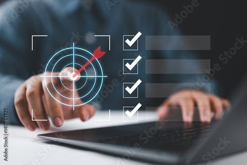 Business goal setting and task management. Businessman interacts with a digital checklist and target icon, representing productivity, goal achievement, and strategic planning.